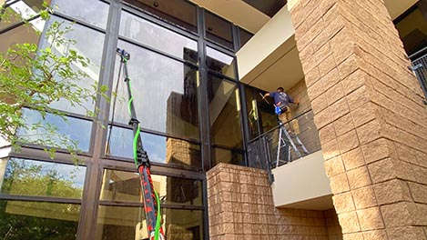 window cleaning with a water-fed pole in the Tucson Foothills